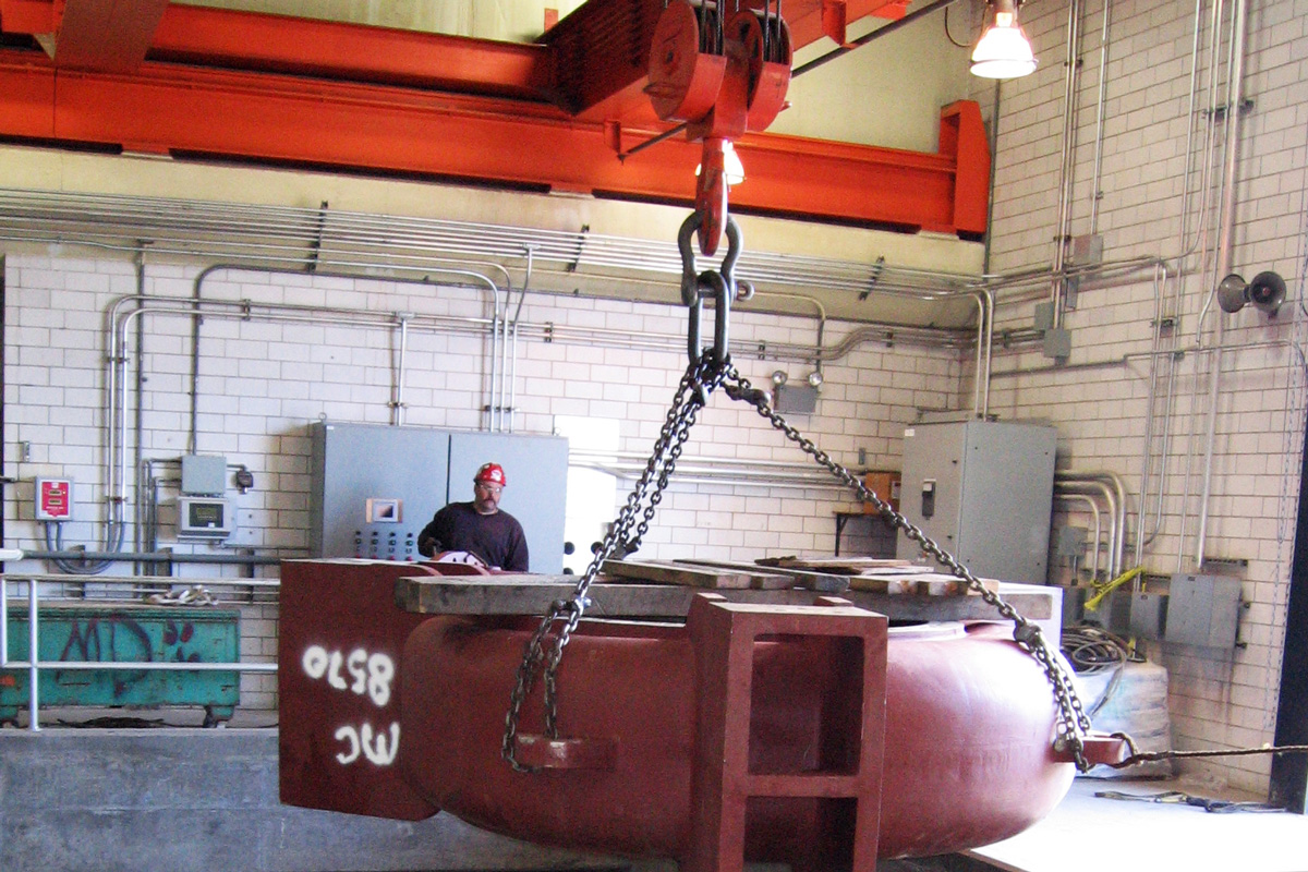 Carefully and safely rigged pump 2 being lifted out of the Riverside Pump Station