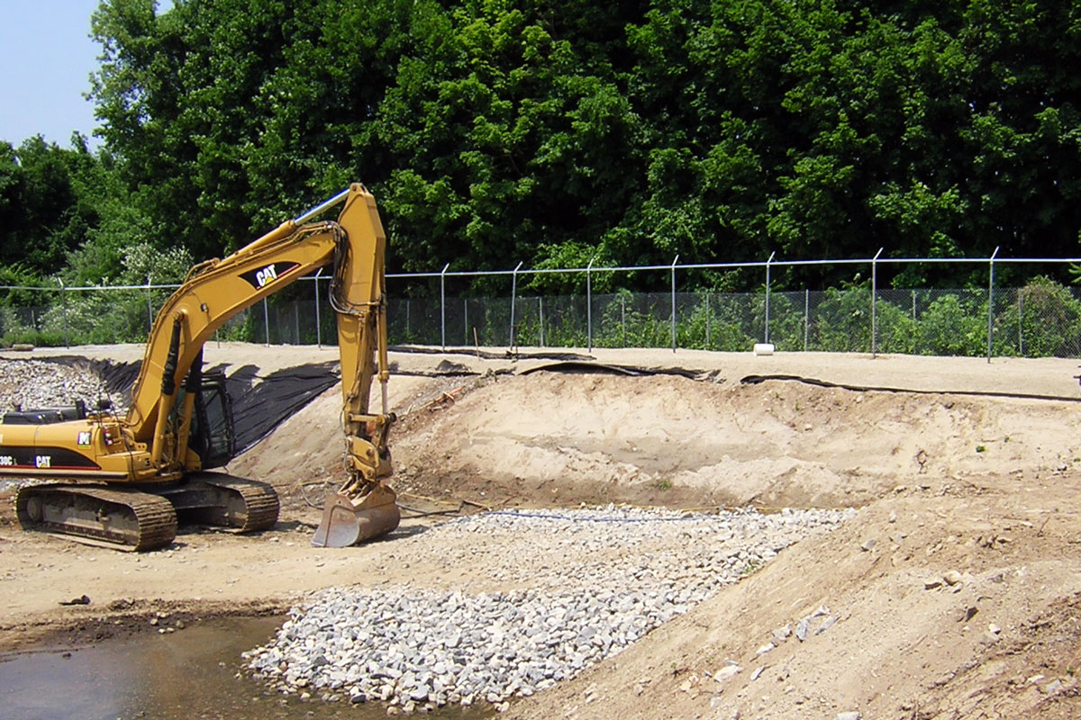 Second lagoon after dredging with secure fencing in background
