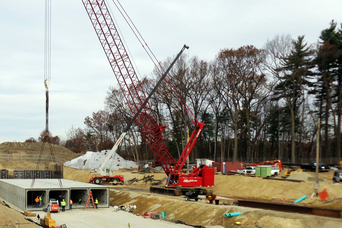 A 250 ton lattice boom crane on a specially designed access road was needed to place the individual units of the holding tank