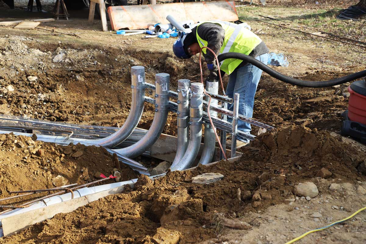 Finishing laying conduit for the the new pump station