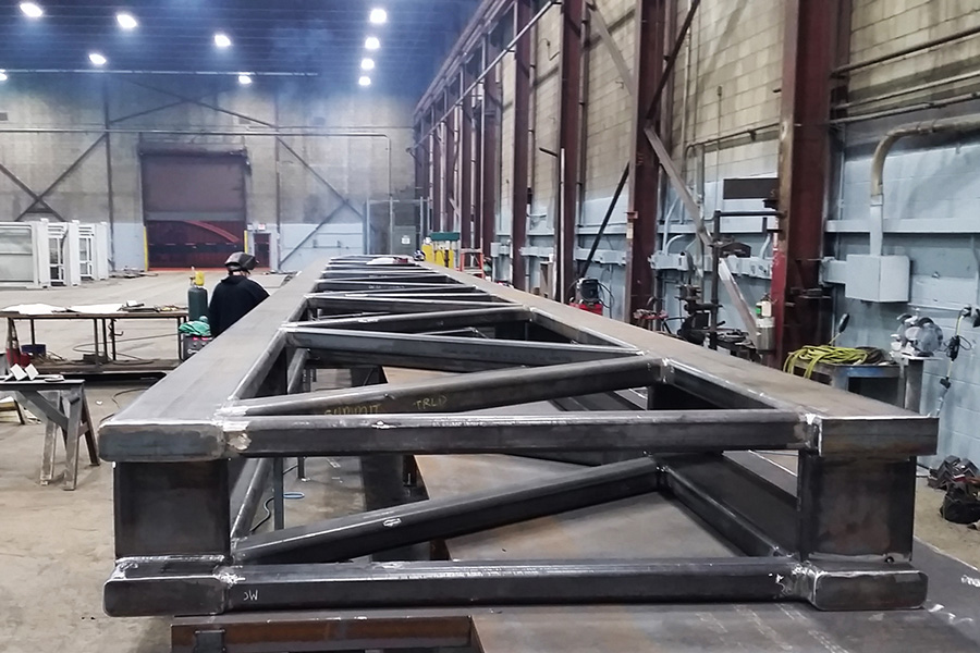 Fabricating the 80' long truss in our fabrication shop