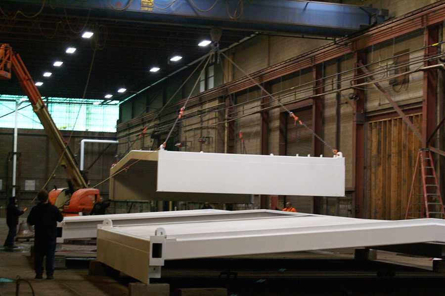 Positioning finished retractable roofs for transport to the shipyard