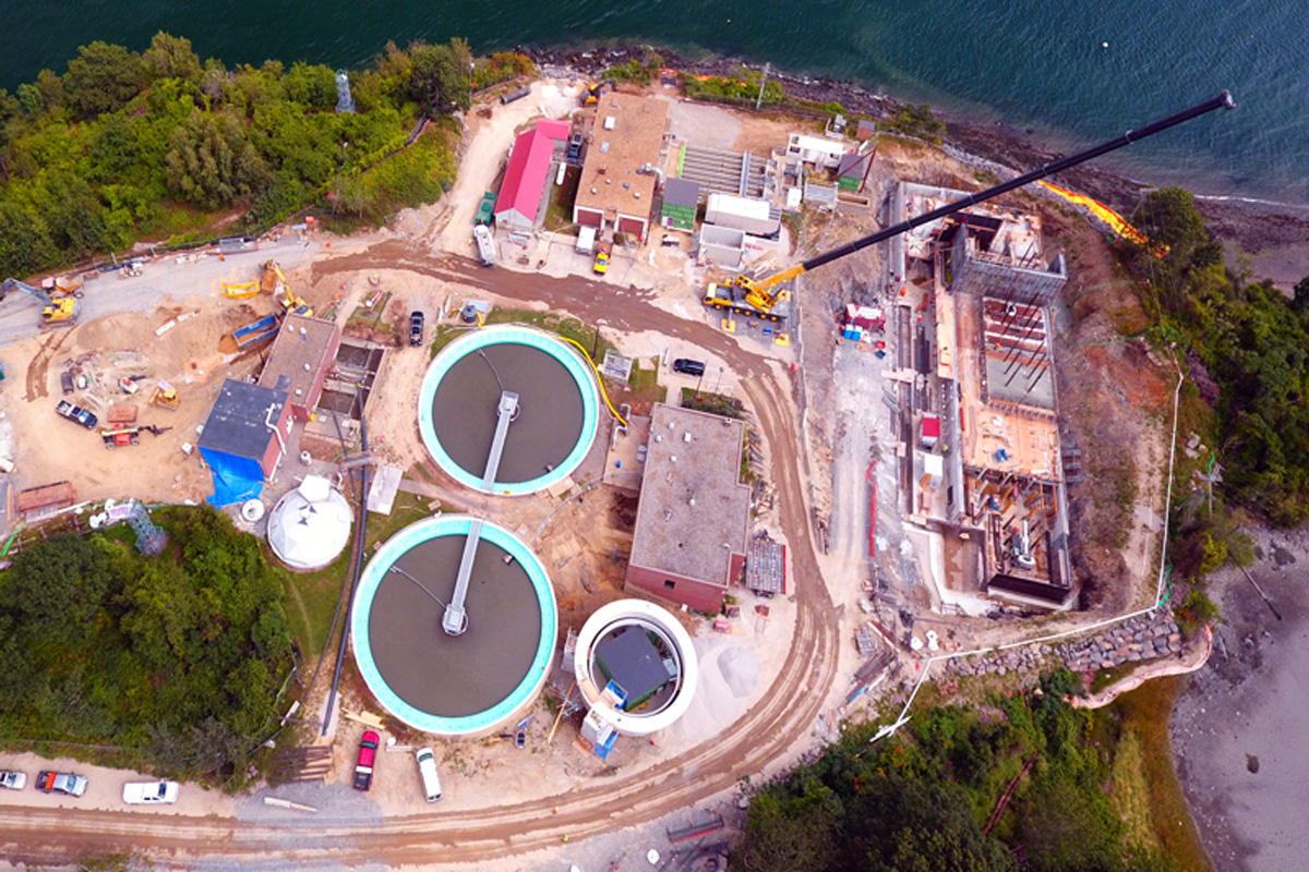 Looking down at the primary clarifiers and current solids processing building to right