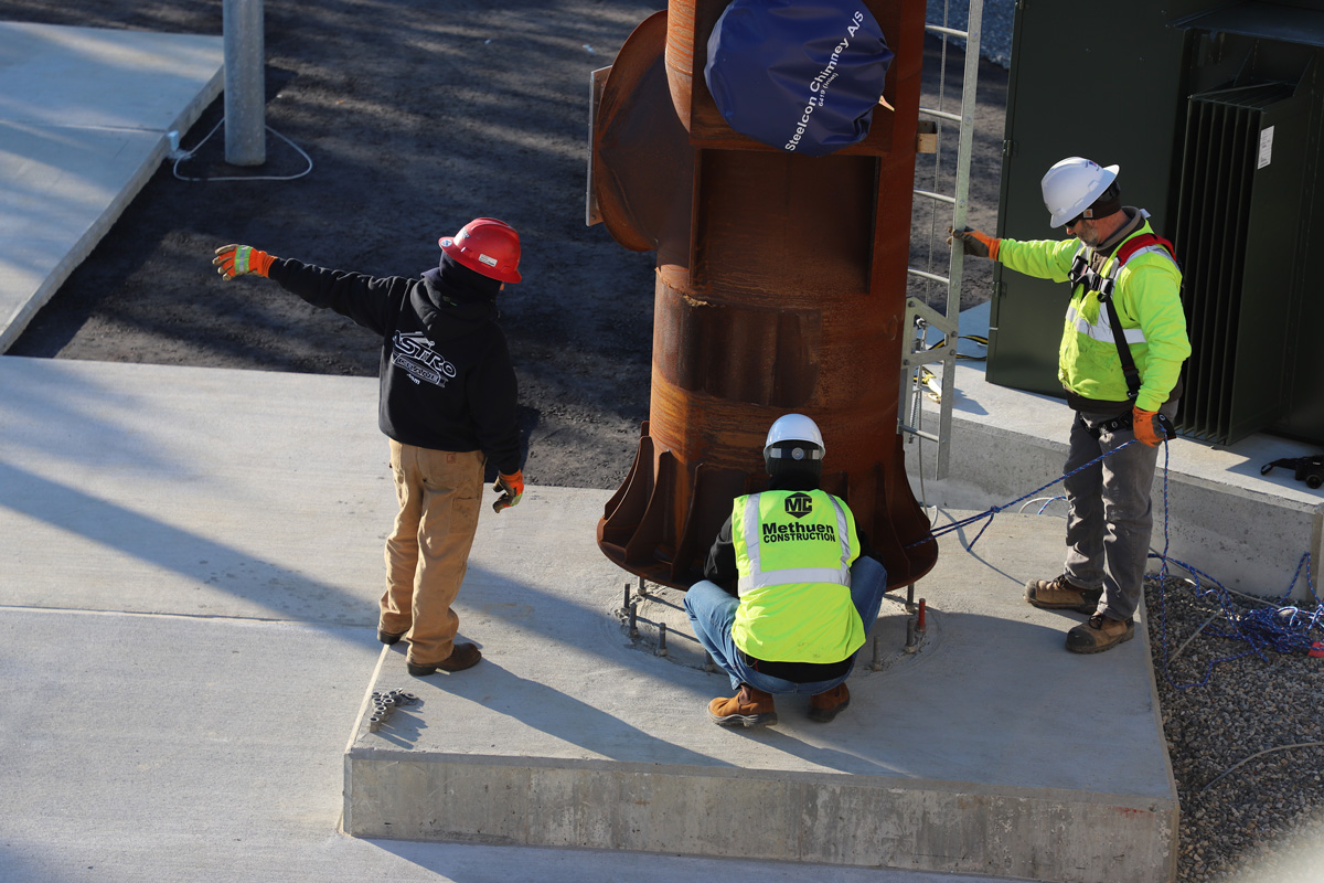 Installing the stack on the pad for the CHP unit at the South Essex Sewerage District in Salem, MA