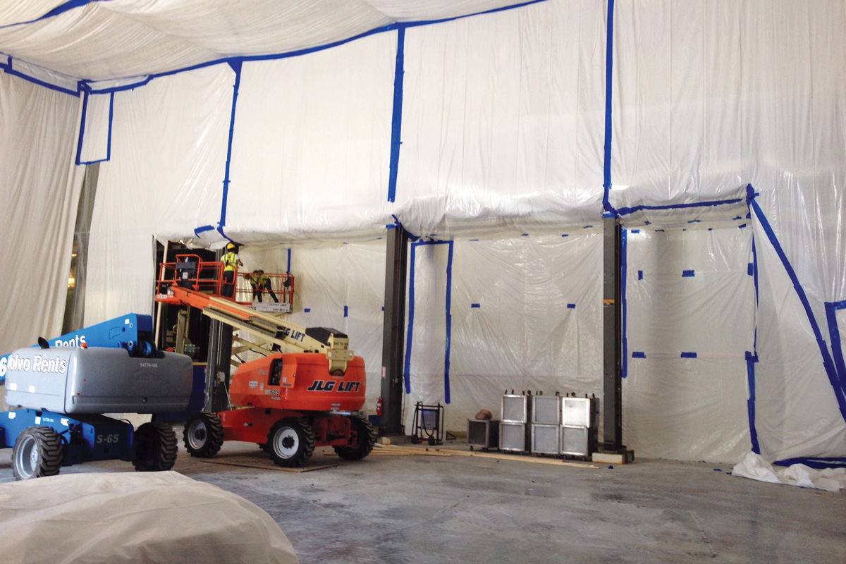 Setting up the contamination chamber for safe removal of the asbestos