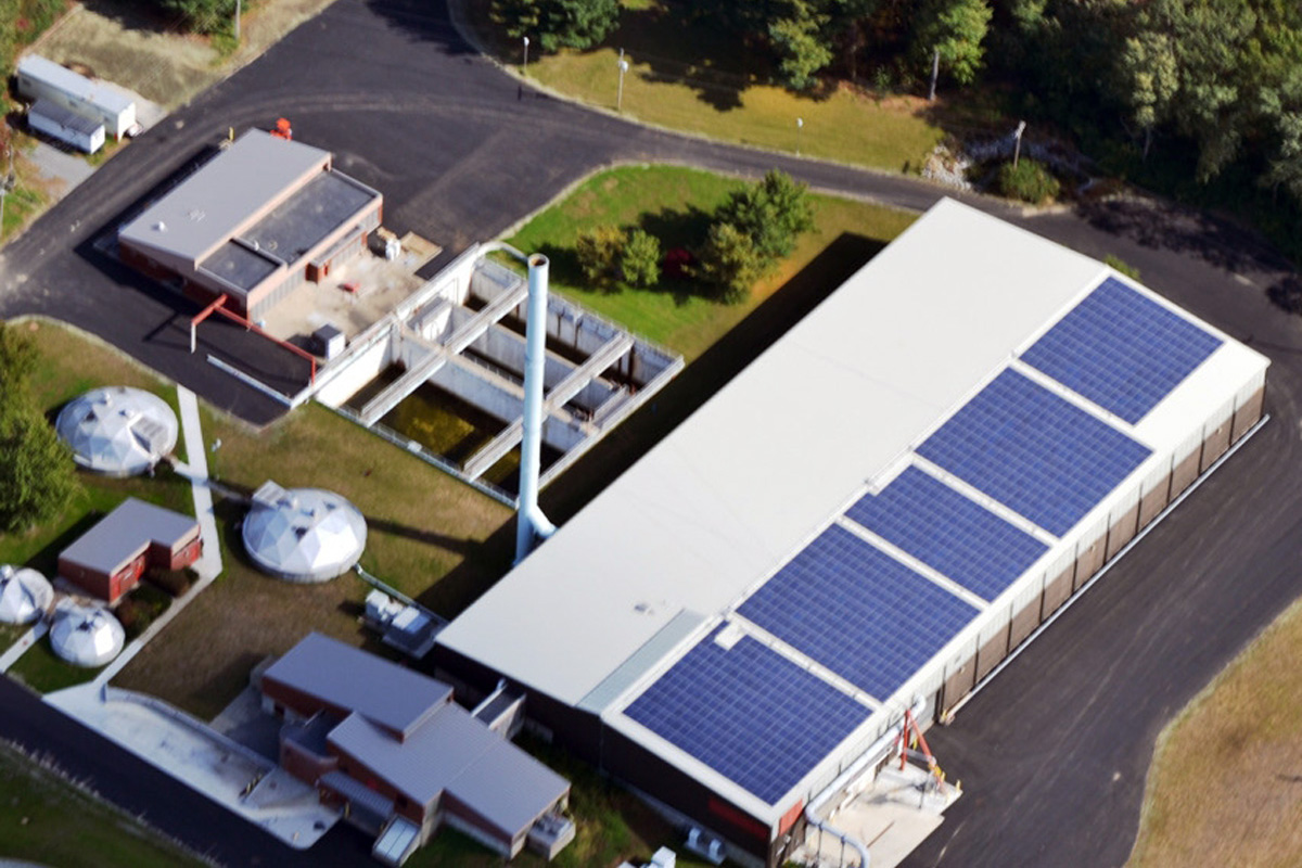 Finished compost building with  968 Evergreen Photovoltaic modules installed on its roof.