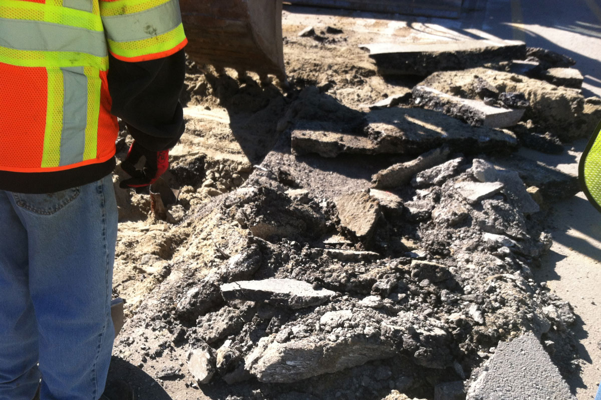 Breaking up the pavement over the catch basin