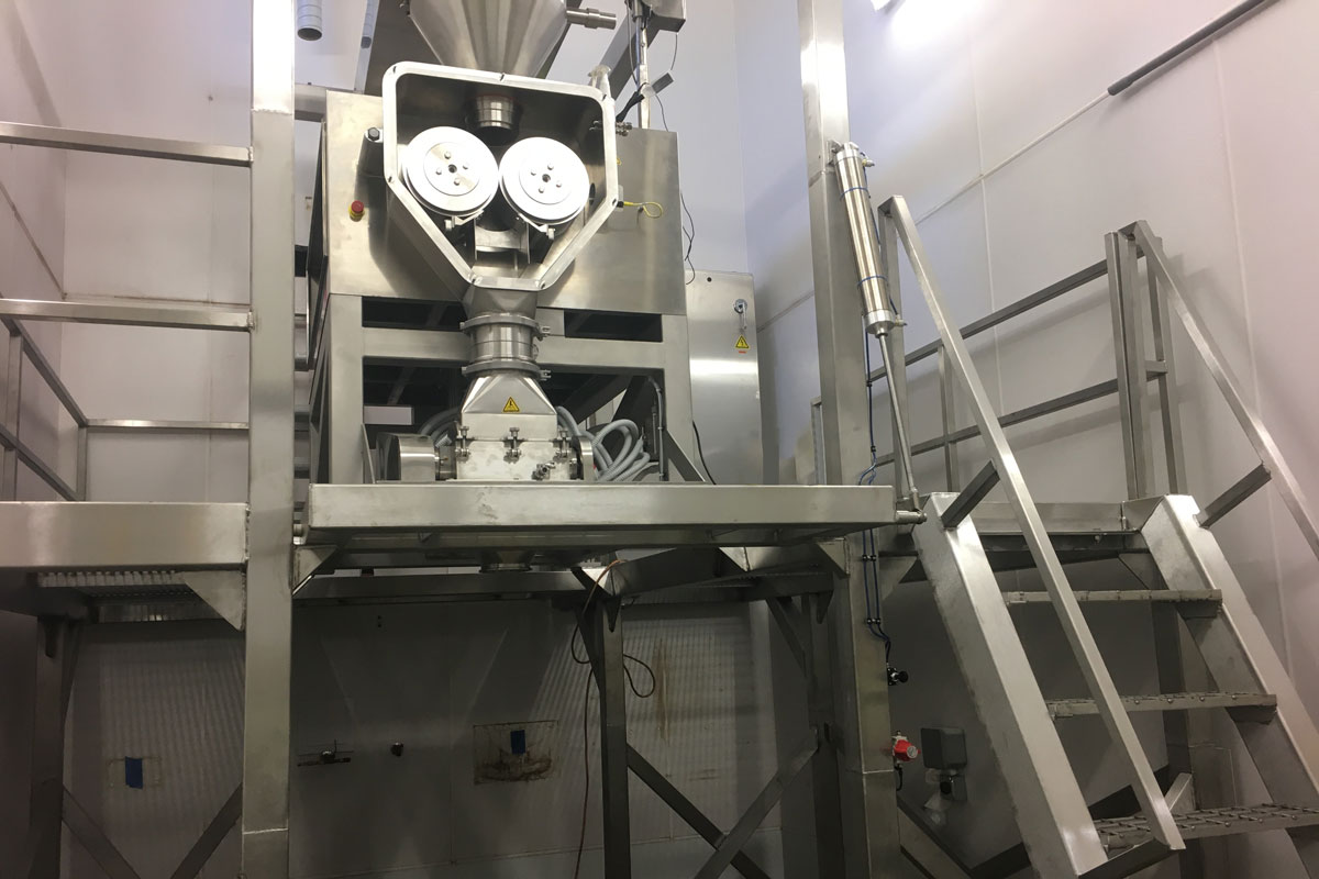 Another view of the new food roller press compactor installed in the press room